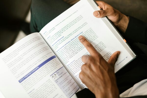 Adult man reading book guide knowledge