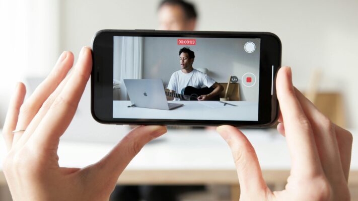 Man recording a video vlog tutorial with smartphone
